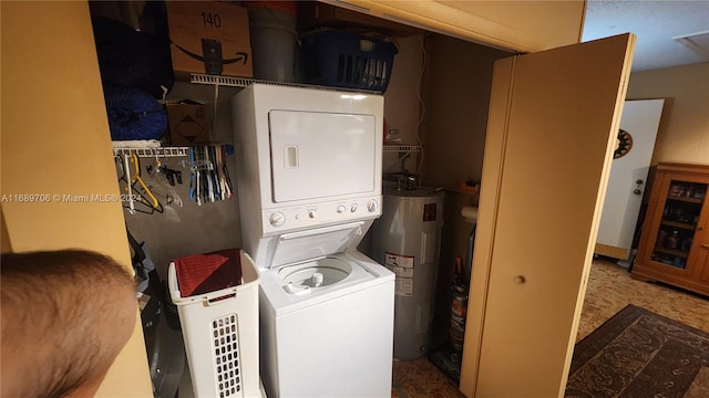 washroom with stacked washing maching and dryer and electric water heater