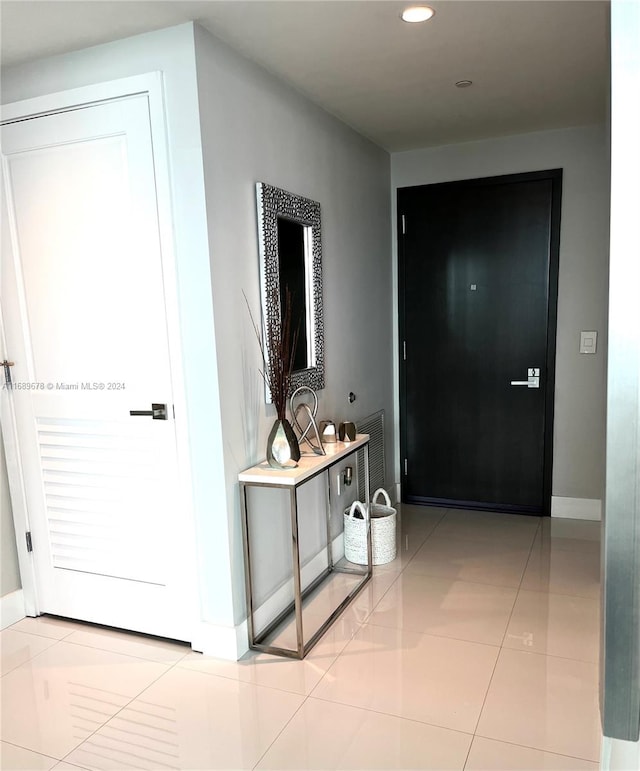 hallway with light tile patterned floors