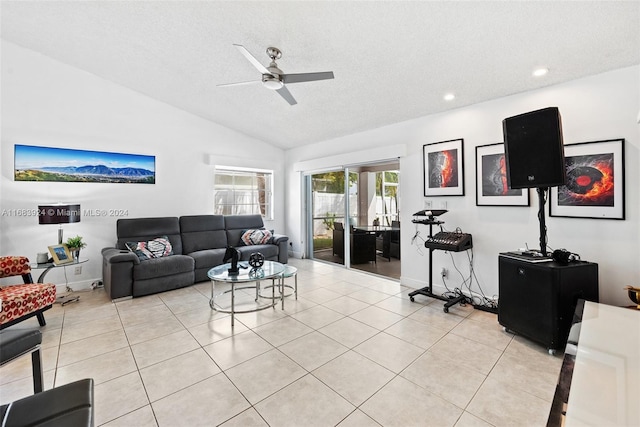 living room featuring ceiling fan, a textured ceiling, light tile patterned floors, and lofted ceiling