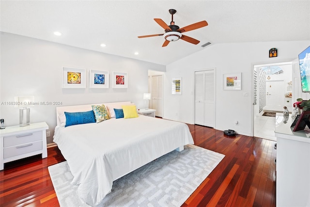 bedroom with dark hardwood / wood-style flooring, a closet, vaulted ceiling, and ceiling fan