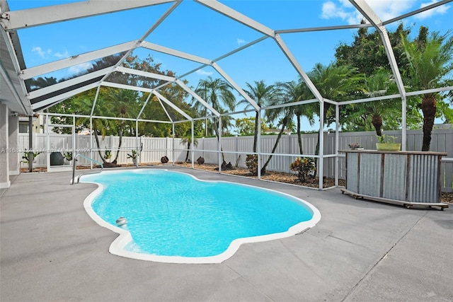 view of pool featuring a patio and glass enclosure