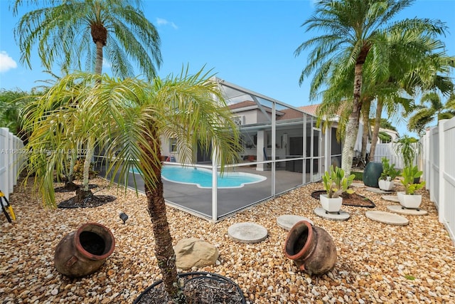 view of pool featuring a patio and glass enclosure