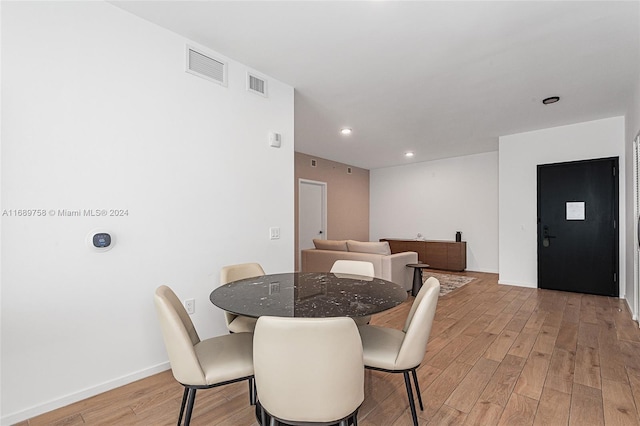 dining area with light hardwood / wood-style flooring