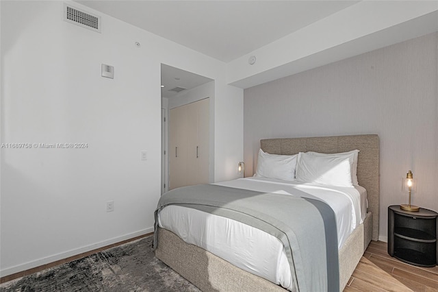 bedroom featuring hardwood / wood-style flooring