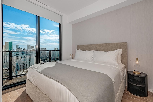 bedroom with hardwood / wood-style floors