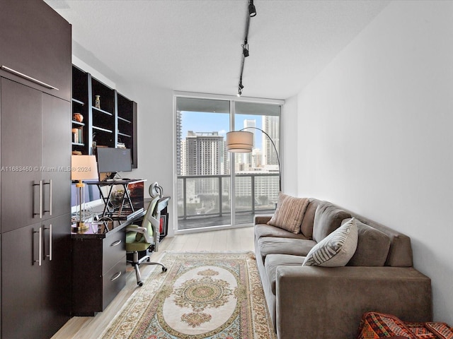 1900 N Bayshore Dr Unit 1704, Miami, FL 33132 - home office with expansive windows, light wood-style floors, and track lighting