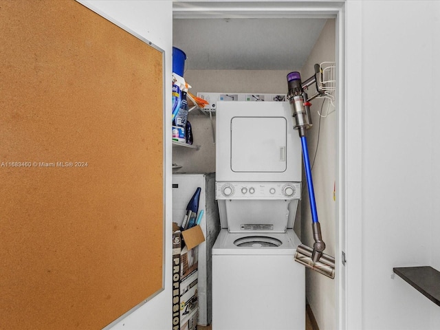 washroom with stacked washer / drying machine