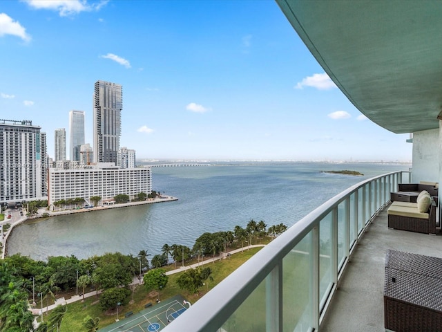 balcony featuring a water view