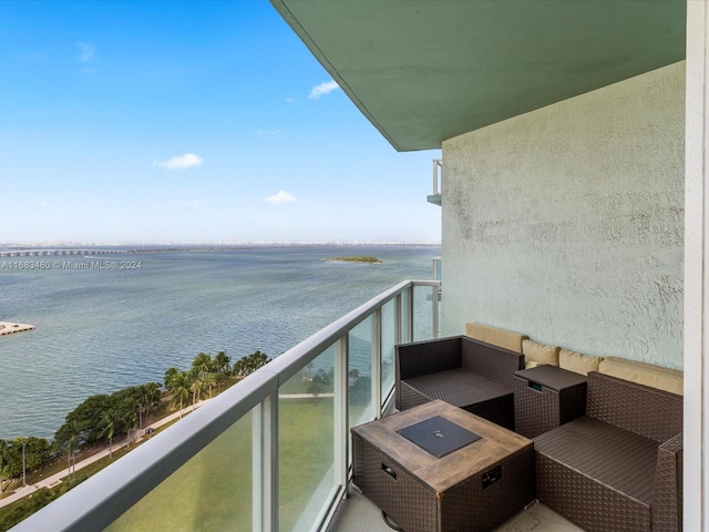 balcony featuring a water view