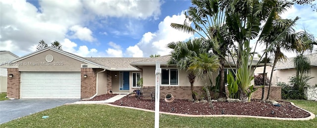 ranch-style house featuring a garage and a front yard