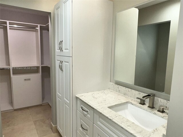 bathroom with toilet, a wealth of natural light, and tile patterned floors