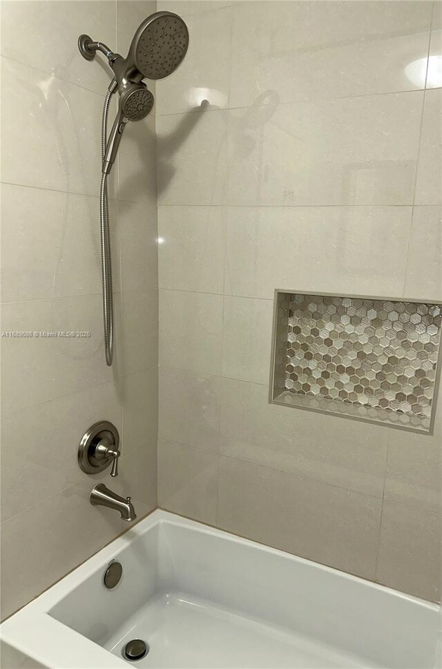 bathroom featuring shower / bath combination with curtain