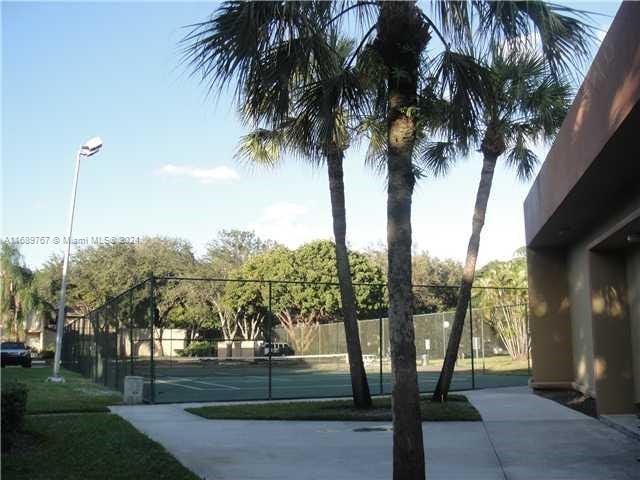 exterior space with tennis court