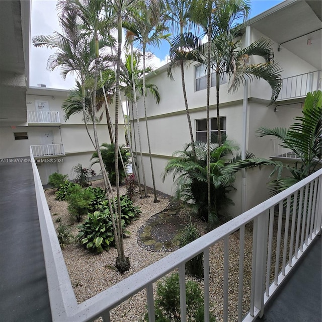 view of side of property with a balcony