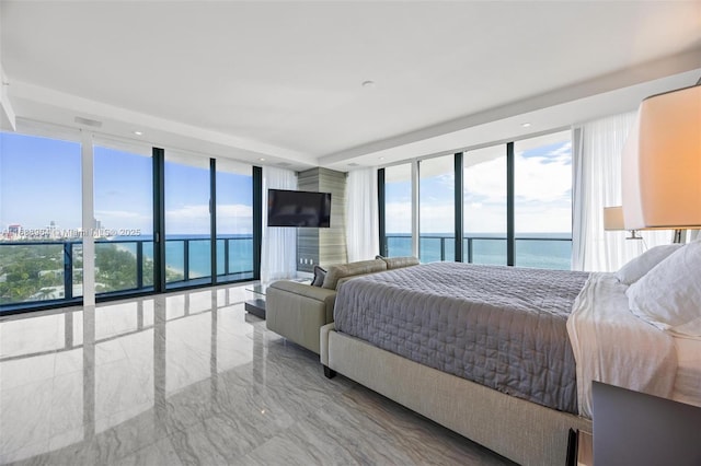 bedroom with multiple windows and expansive windows