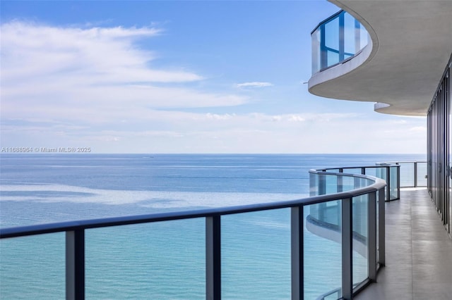 balcony featuring a water view