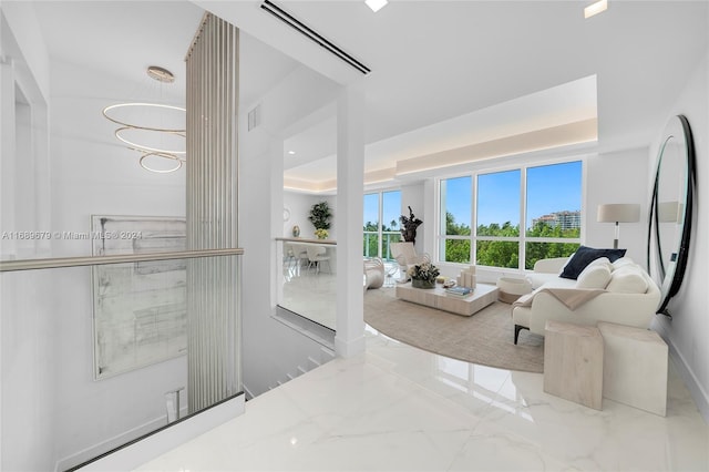 living room featuring an inviting chandelier