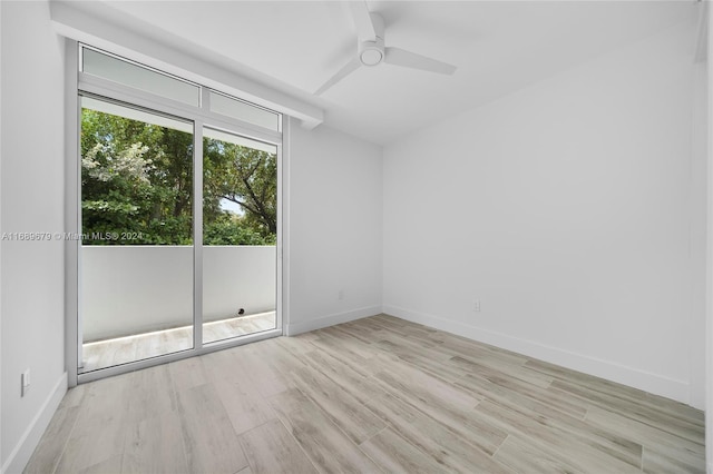 empty room featuring light hardwood / wood-style flooring and ceiling fan