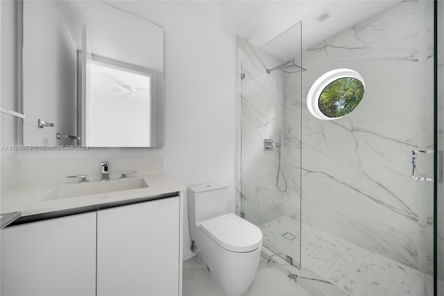 bathroom featuring walk in shower, vanity, and toilet