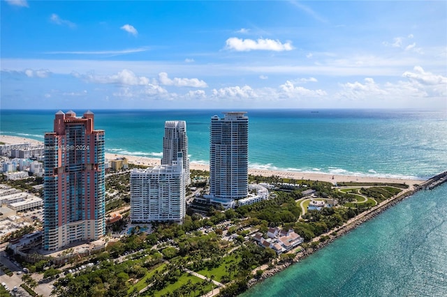 bird's eye view with a view of the beach and a water view