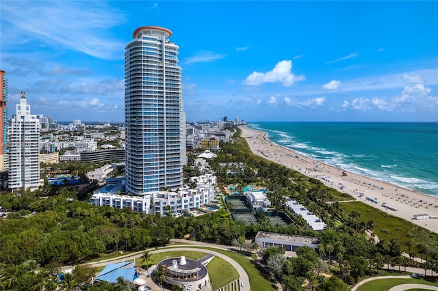 bird's eye view featuring a view of the beach and a water view