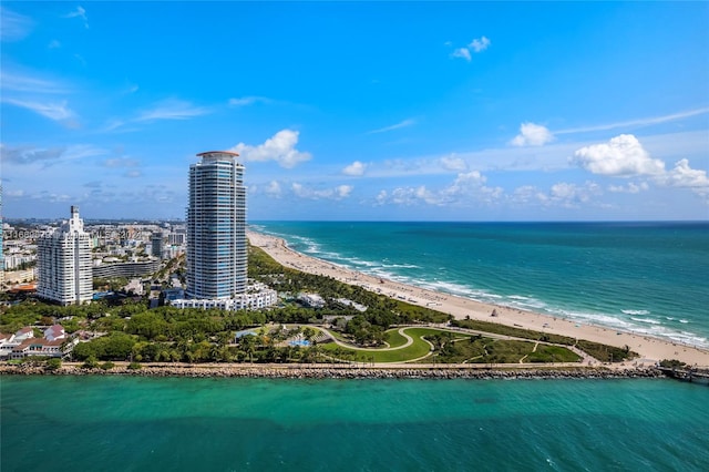 birds eye view of property with a beach view and a water view