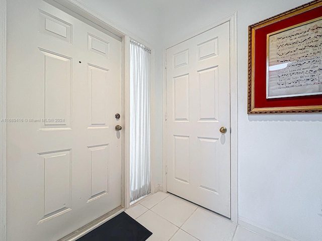 foyer entrance featuring light tile patterned floors