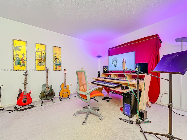 rec room with carpet floors and a textured ceiling