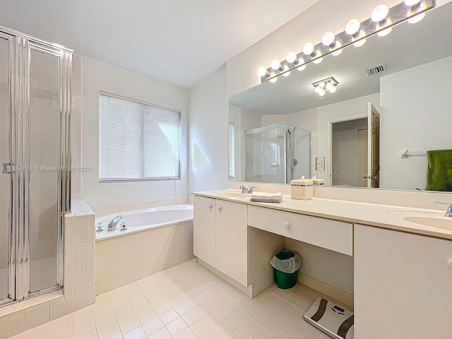 bathroom featuring tile patterned floors, vanity, and separate shower and tub