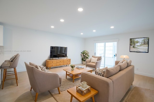 living room with light hardwood / wood-style flooring