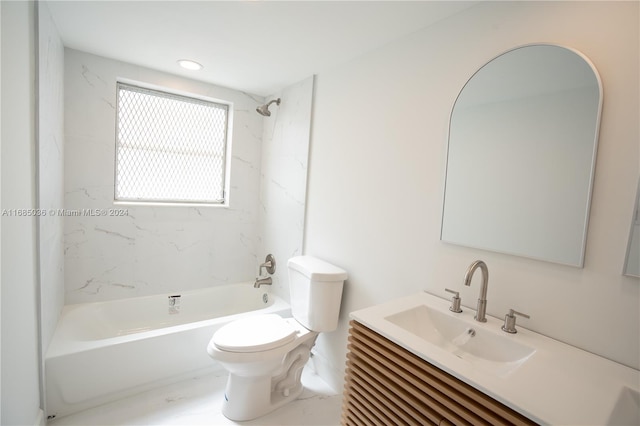 full bathroom with toilet, tiled shower / bath combo, and vanity