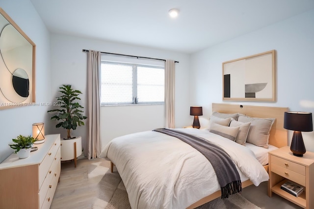 bedroom with light wood-type flooring