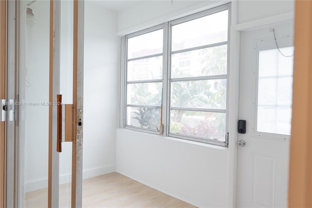 doorway with light wood-type flooring