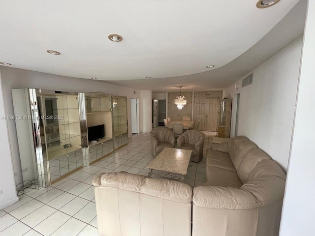 unfurnished living room featuring light tile patterned floors