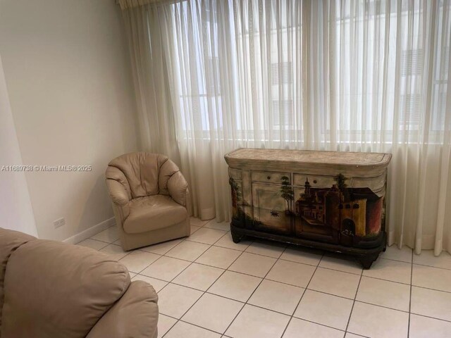 sitting room with light tile patterned floors