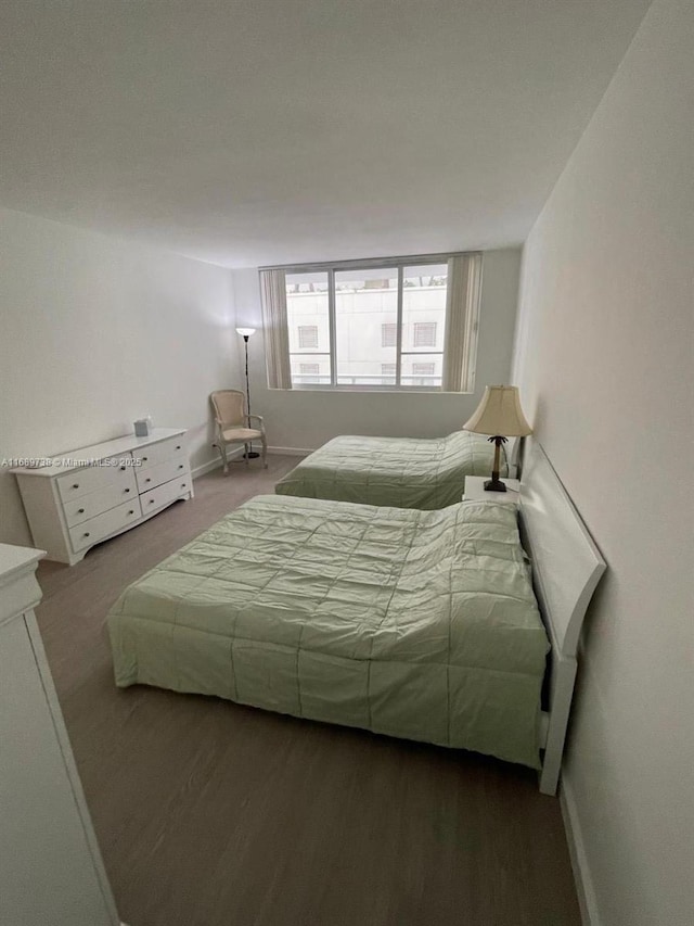 bedroom with hardwood / wood-style flooring