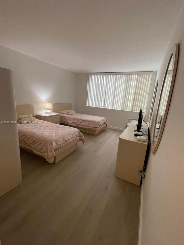 bedroom with light wood-type flooring