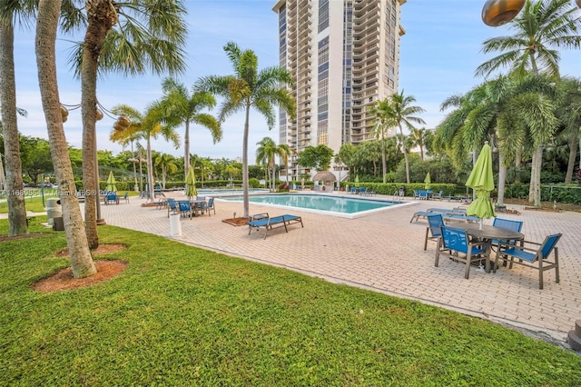 view of pool featuring a yard and a patio area