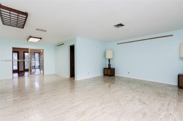 empty room with light wood-type flooring