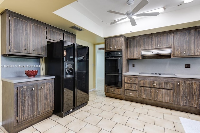 kitchen featuring exhaust hood, dark brown cabinetry, and black appliances