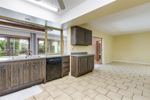 kitchen featuring light tile patterned floors, dark brown cabinets, black dishwasher, sink, and ceiling fan