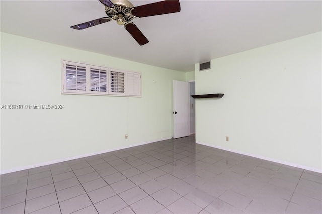 unfurnished room with light tile patterned flooring and ceiling fan