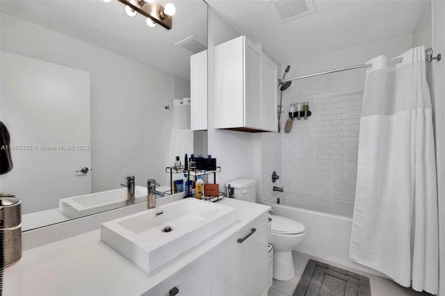 full bathroom with vanity, tile patterned flooring, shower / bath combination with curtain, and toilet