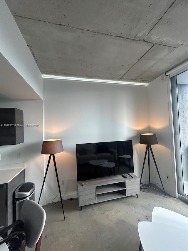 living room featuring concrete floors