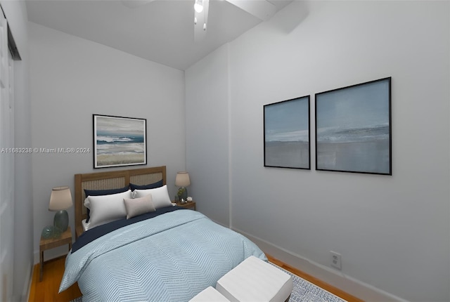 bedroom featuring hardwood / wood-style floors and ceiling fan