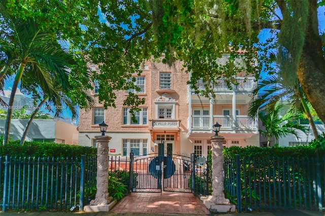 view of front of home featuring a balcony