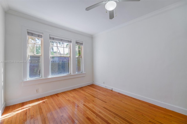 empty room featuring ornamental molding, ceiling fan, and light hardwood / wood-style floors