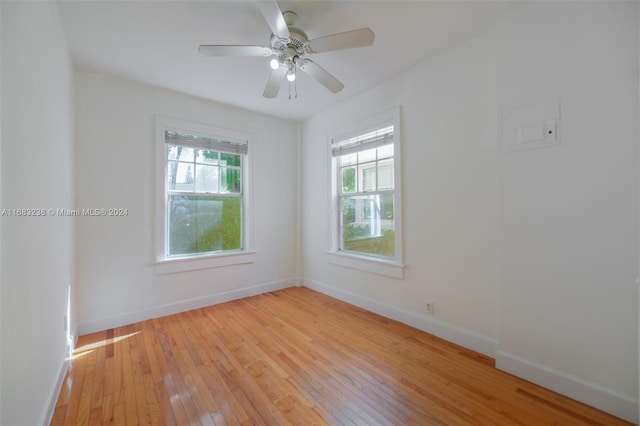 spare room with ceiling fan and light hardwood / wood-style flooring