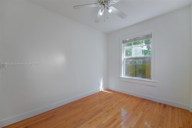 empty room with light wood-type flooring and ceiling fan