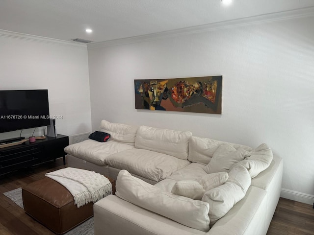 living room with dark wood-type flooring and crown molding